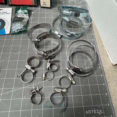 Sale Photo Thumbnail #222: Includes Arrow staples, 3M tape, hose clamps, shelf bracket.