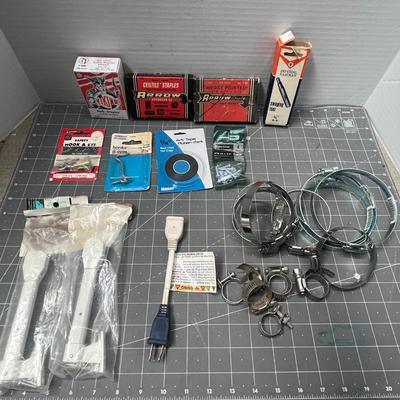 Sale Photo Thumbnail #221: Includes Arrow staples, 3M tape, hose clamps, shelf bracket.