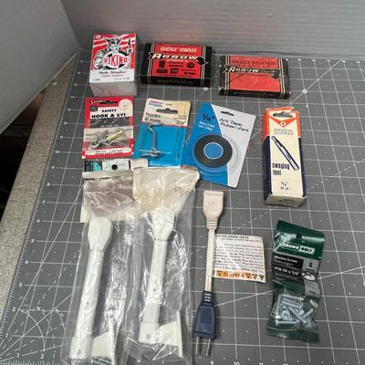 Sale Photo Thumbnail #223: Includes Arrow staples, 3M tape, hose clamps, shelf bracket.