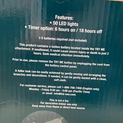 Sale Photo Thumbnail #303: Battery-operated, auto timer, red poinsettias, ornaments, pinecones.