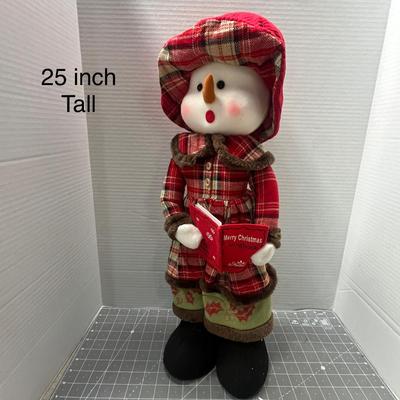 Sale Photo Thumbnail #306: Wears red plaid coat, green pants, holds “Merry Christmas” book.