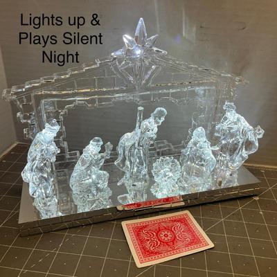 Sale Photo Thumbnail #310: Includes 6 clear figures under LED-lit stable; musical base plays “Silent Night.”