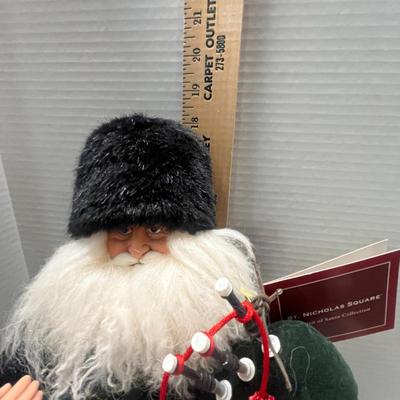 Sale Photo Thumbnail #330: 18" tall, tartan kilt, holds bagpipes.