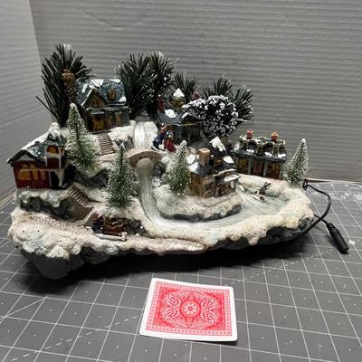 Sale Photo Thumbnail #399: Lights up, snowy buildings, sleigh, figurines.