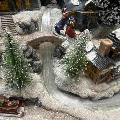 Sale Photo Thumbnail #400: Lights up, snowy buildings, sleigh, figurines.