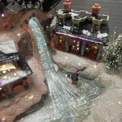 Sale Photo Thumbnail #401: Lights up, snowy buildings, sleigh, figurines.