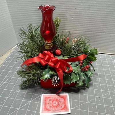 Sale Photo Thumbnail #413: Red lantern with Santa, glass candle holder, pine, berries.