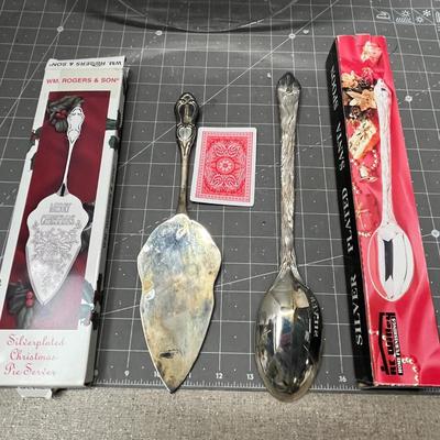 Sale Photo Thumbnail #466: Ornate handles, marked “International Silver Company.”