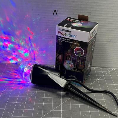 Sale Photo Thumbnail #499: Multicolor swirling projector—covers 20ft, outdoor-ready with stake.