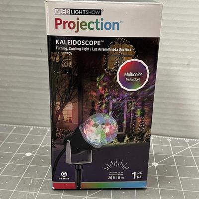Sale Photo Thumbnail #500: Multicolor swirling projector—covers 20ft, outdoor-ready with stake.
