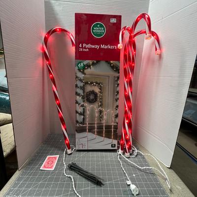 Sale Photo Thumbnail #503: Set – 4 Pc; 28" candy cane lights with 48 bulbs—outdoor holiday decoration.