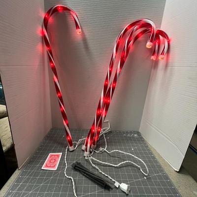 Sale Photo Thumbnail #502: Set – 4 Pc; 28" candy cane lights with 48 bulbs—outdoor holiday decoration.