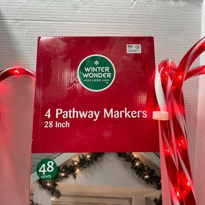 Sale Photo Thumbnail #504: Set – 4 Pc; 28" candy cane lights with 48 bulbs—outdoor holiday decoration.