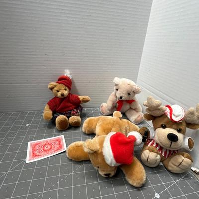 Sale Photo Thumbnail #508: 12 Pc, Assorted plush toys in Christmas outfits—Santa hats, scarves, elf suits.