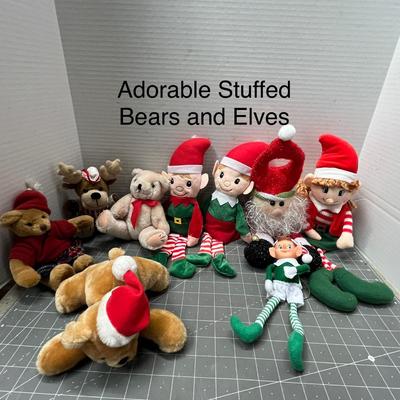 Sale Photo Thumbnail #506: 12 Pc, Assorted plush toys in Christmas outfits—Santa hats, scarves, elf suits.