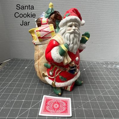 Sale Photo Thumbnail #561: Ceramic—red suit, gift sack, teddy bear detail.
