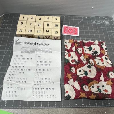 Sale Photo Thumbnail #569: 15 pc numbered blocks, snowman bag, printed holiday guide.