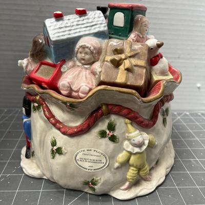Sale Photo Thumbnail #583: Ceramic—bear, giraffe, train, doll, holly ribbon base.