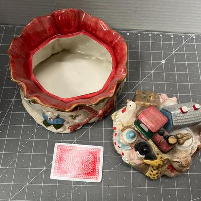 Sale Photo Thumbnail #581: Ceramic—bear, giraffe, train, doll, holly ribbon base.