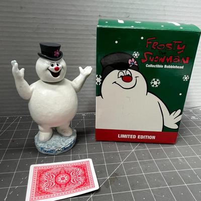 Sale Photo Thumbnail #594: 6.5 in tall—white snowman with hat, flower, base and box.