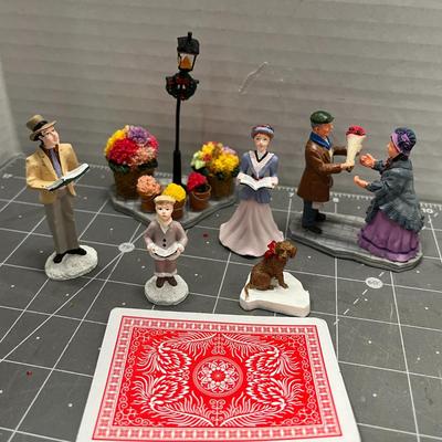 Sale Photo Thumbnail #606: People skating, sledding, dancing, singing, trees, ice patches.