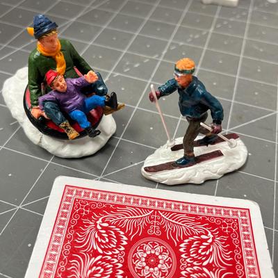 Sale Photo Thumbnail #609: People skating, sledding, dancing, singing, trees, ice patches.