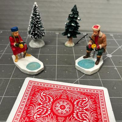 Sale Photo Thumbnail #608: People skating, sledding, dancing, singing, trees, ice patches.