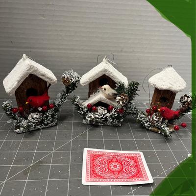 Sale Photo Thumbnail #619: 13 pc—snow-roof birdhouses with red birds and greenery.