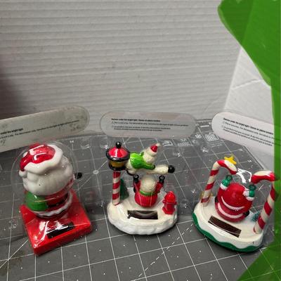 Sale Photo Thumbnail #623: 7 pc—3 boxed (Santa cradle, house, bears) + 4 loose Santa-themed figures.