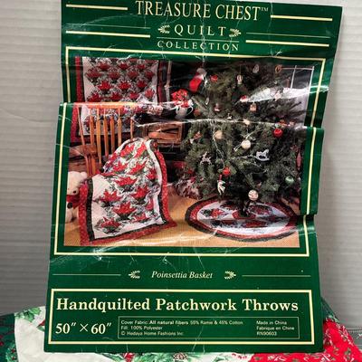 Sale Photo Thumbnail #650: Treasure Chest, 50×60 in, handquilted cotton throw, red/green Christmas design.