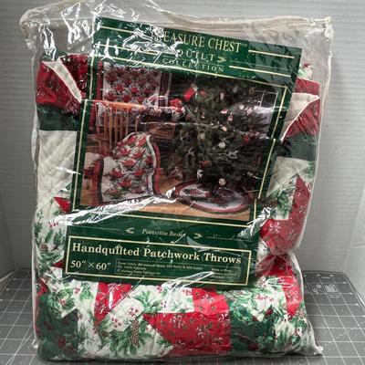 Sale Photo Thumbnail #648: Treasure Chest, 50×60 in, handquilted cotton throw, red/green Christmas design.