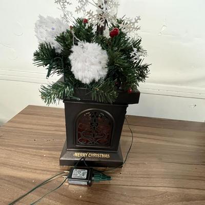 Sale Photo Thumbnail #704: Black lamp post, glowing lantern, snowy top, festive decorated base.