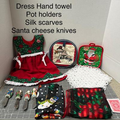 Sale Photo Thumbnail #713: Dress towel, pot holders, scarves, four Santa cheese knives.