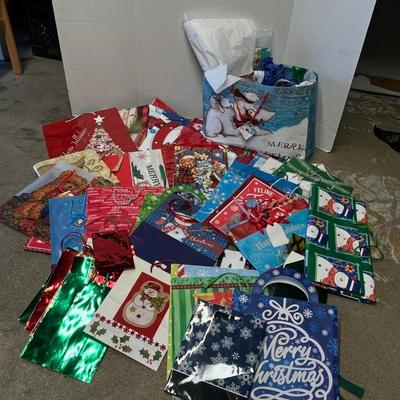 Sale Photo Thumbnail #726: 50 assorted bags, colorful tissue, festive holiday designs.