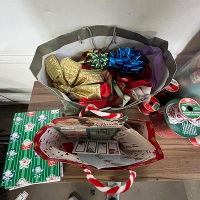 Sale Photo Thumbnail #730: Gift boxes, ribbons, bows, tags, festive wrapping paper.