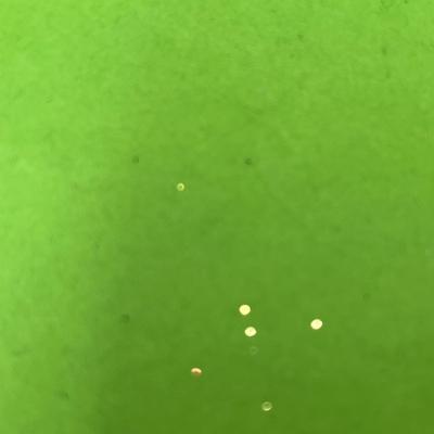 Sale Photo Thumbnail #761: Black cylindrical lamp, textured dome, glowing red reflections.