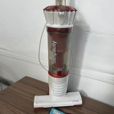 Sale Photo Thumbnail #763: Compact electric broom vacuum, 120V, includes owner’s manual.