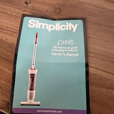 Sale Photo Thumbnail #764: Compact electric broom vacuum, 120V, includes owner’s manual.