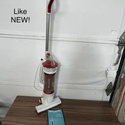 Sale Photo Thumbnail #762: Compact electric broom vacuum, 120V, includes owner’s manual.