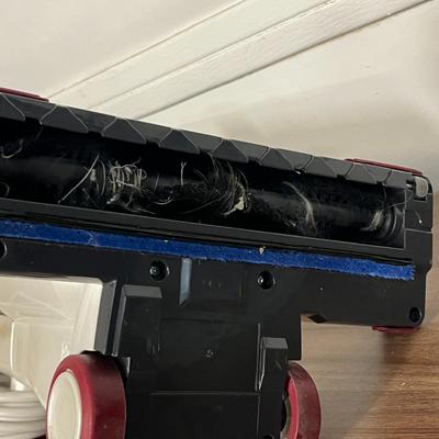 Sale Photo Thumbnail #766: Compact electric broom vacuum, 120V, includes owner’s manual.