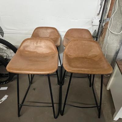 Sale Photo Thumbnail #28: Set of 4 faux leather upholstered chairs.