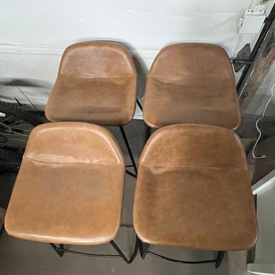 Sale Photo Thumbnail #29: Set of 4 faux leather upholstered chairs.
