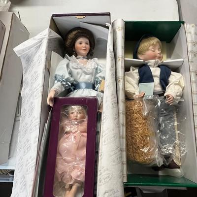 Sale Photo Thumbnail #886: Lady & Baby Size - 18", 8" & Boy Size - 14" Includes straw bedding, lace dress, vest outfit, boxed presentation.