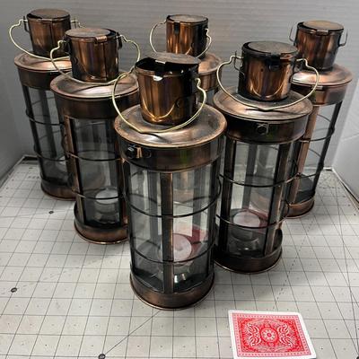 Sale Photo Thumbnail #949: Includes tealights, glass body, metal frame, rustic bronze finish.