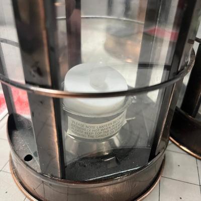 Sale Photo Thumbnail #951: Includes tealights, glass body, metal frame, rustic bronze finish.