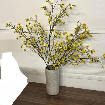 Sale Photo Thumbnail #966: Tall white vase, spring florals, yellow blossoms, green leaves, indoor decor.