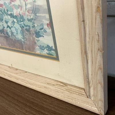 Sale Photo Thumbnail #971: Blue bench, stucco wall, plants, flowers, serene outdoor setting.