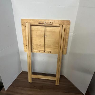 Sale Photo Thumbnail #1036: Portable rectangular table with support bar, light wood finish, compact.