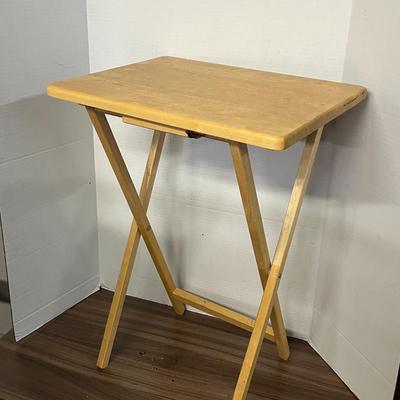 Sale Photo Thumbnail #1033: Portable rectangular table with support bar, light wood finish, compact.