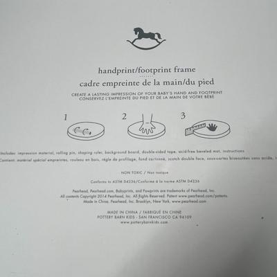 Sale Photo Thumbnail #1069: 17×10 inch frame with baby photo, handprint, footprint molds.